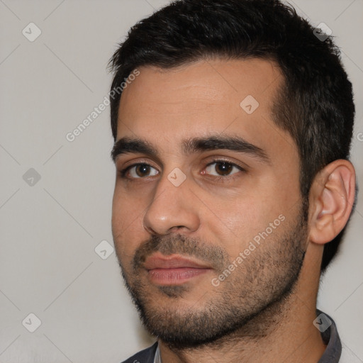 Joyful white young-adult male with short  black hair and brown eyes