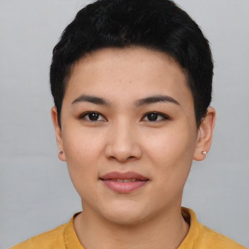 Joyful asian young-adult female with short  black hair and brown eyes