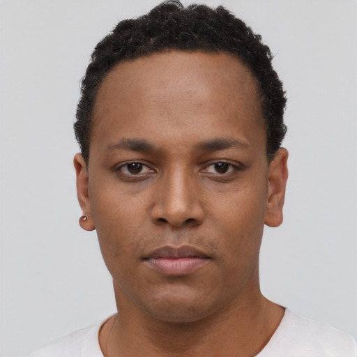Neutral black young-adult male with short  black hair and brown eyes