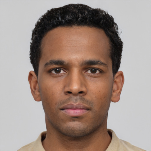 Neutral black young-adult male with short  black hair and brown eyes