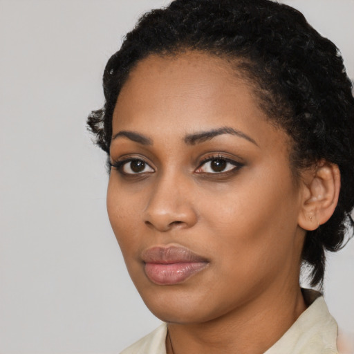 Neutral black young-adult female with medium  black hair and brown eyes