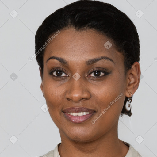 Joyful black young-adult female with short  black hair and brown eyes