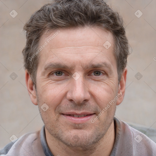 Joyful white adult male with short  brown hair and grey eyes