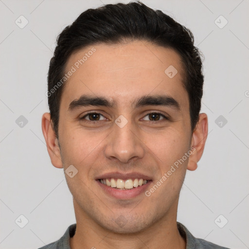 Joyful white young-adult male with short  brown hair and brown eyes