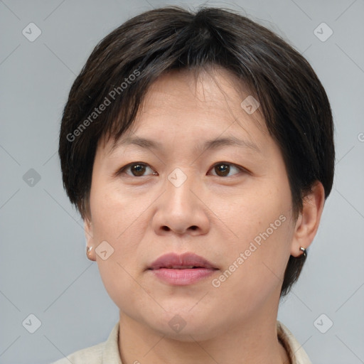 Joyful white adult female with medium  brown hair and brown eyes