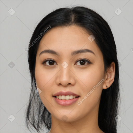 Joyful asian young-adult female with long  black hair and brown eyes