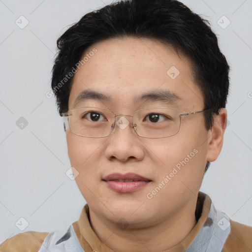 Joyful asian young-adult male with short  brown hair and brown eyes