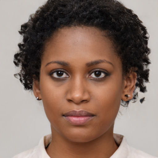 Neutral black young-adult female with short  brown hair and brown eyes