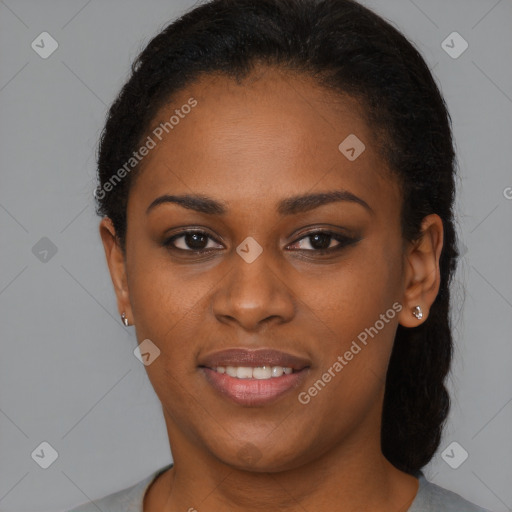 Joyful black young-adult female with short  brown hair and brown eyes