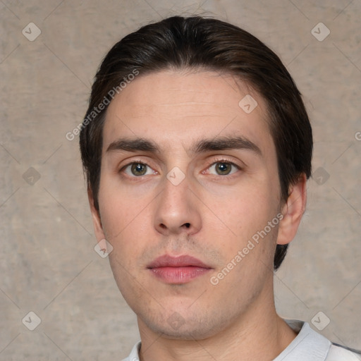 Neutral white young-adult male with short  brown hair and brown eyes