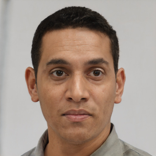 Neutral white adult male with short  black hair and brown eyes