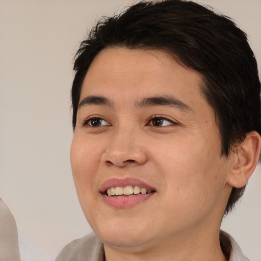 Joyful white young-adult male with medium  brown hair and brown eyes