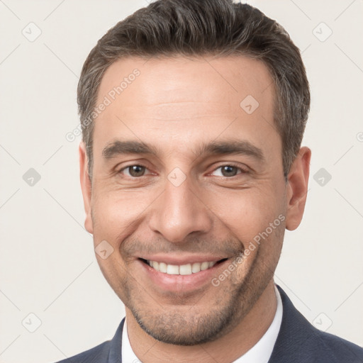 Joyful white young-adult male with short  brown hair and brown eyes