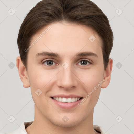 Joyful white young-adult female with short  brown hair and grey eyes