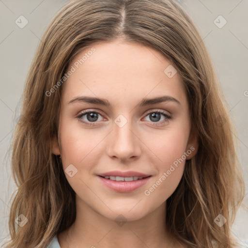 Joyful white young-adult female with long  brown hair and green eyes