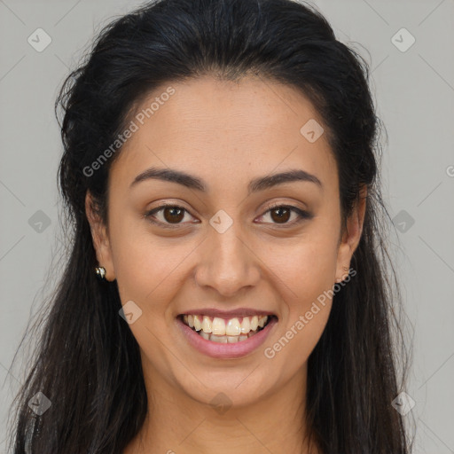 Joyful latino young-adult female with long  brown hair and brown eyes