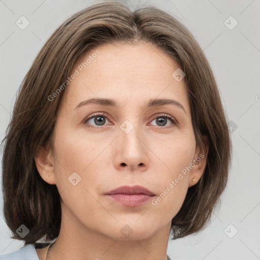 Neutral white young-adult female with medium  brown hair and grey eyes