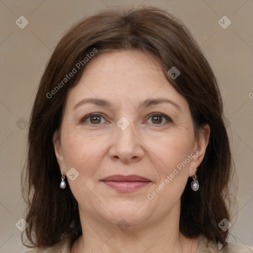 Joyful white adult female with medium  brown hair and grey eyes