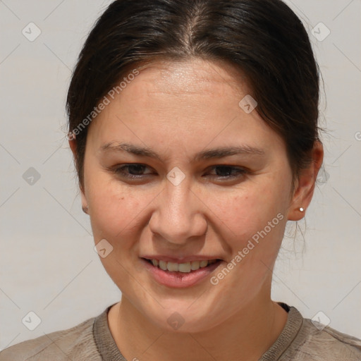 Joyful white adult female with medium  brown hair and brown eyes