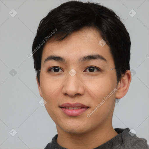 Joyful asian young-adult male with short  black hair and brown eyes