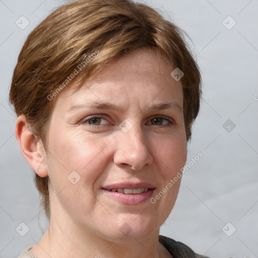 Joyful white adult female with short  brown hair and grey eyes