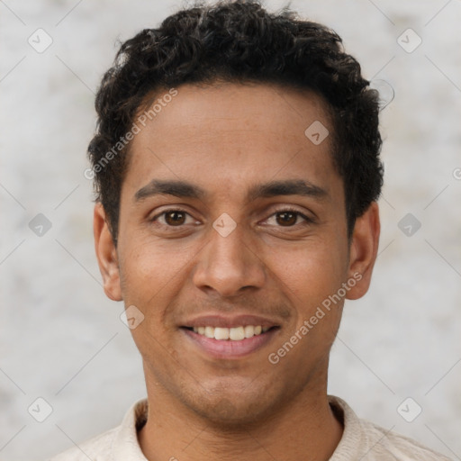 Joyful latino young-adult male with short  brown hair and brown eyes