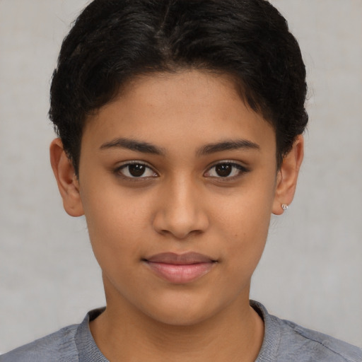 Joyful latino young-adult female with short  brown hair and brown eyes