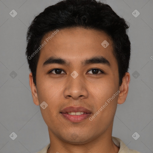 Joyful latino young-adult male with short  black hair and brown eyes