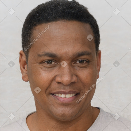 Joyful black young-adult male with short  brown hair and brown eyes