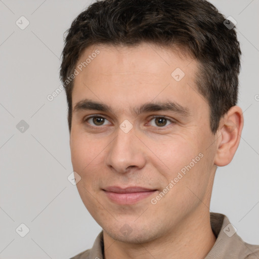 Joyful white young-adult male with short  brown hair and brown eyes