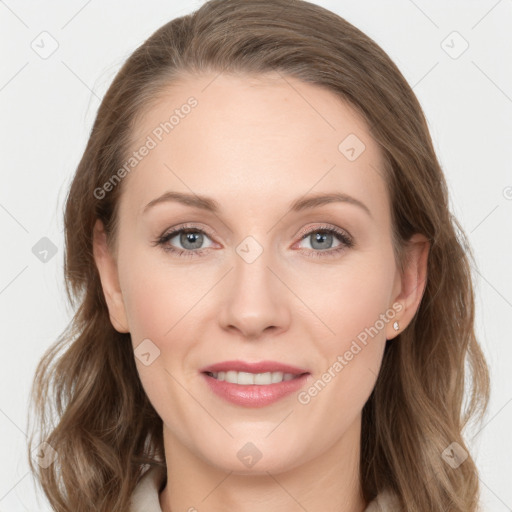 Joyful white young-adult female with long  brown hair and blue eyes