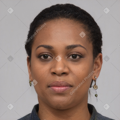 Joyful black young-adult female with short  black hair and brown eyes