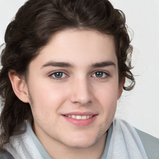 Joyful white young-adult male with medium  brown hair and brown eyes