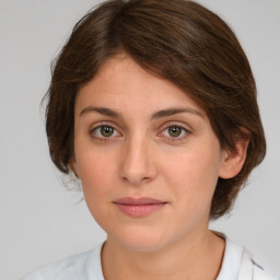 Joyful white young-adult female with medium  brown hair and green eyes