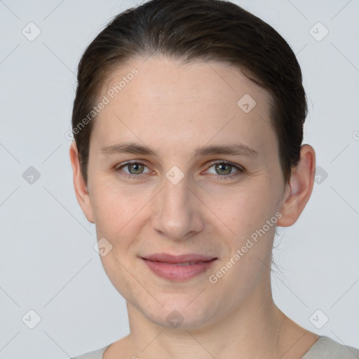 Joyful white young-adult female with short  brown hair and grey eyes