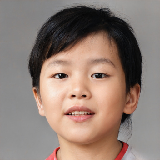 Joyful asian child male with short  brown hair and brown eyes