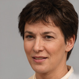 Joyful white adult female with short  brown hair and brown eyes