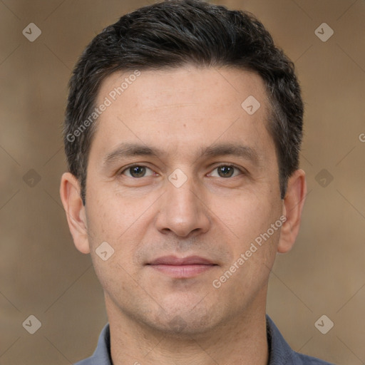 Joyful white adult male with short  brown hair and brown eyes