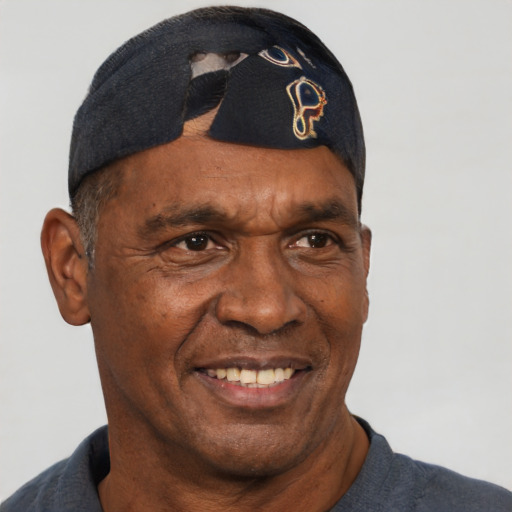 Joyful black adult male with short  black hair and brown eyes