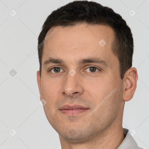 Joyful white young-adult male with short  brown hair and brown eyes