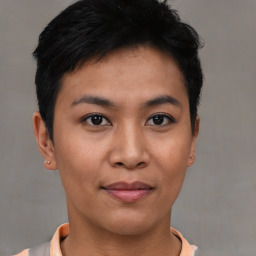 Joyful asian young-adult female with short  black hair and brown eyes