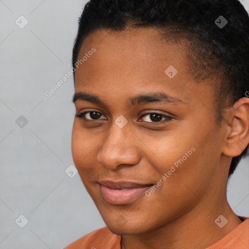 Joyful black young-adult female with short  brown hair and brown eyes