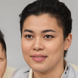 Joyful latino young-adult female with short  brown hair and brown eyes