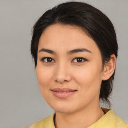 Joyful asian young-adult female with medium  brown hair and brown eyes