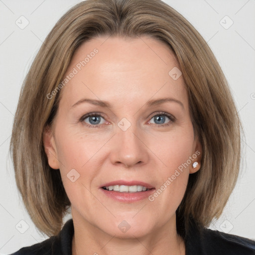 Joyful white adult female with medium  brown hair and grey eyes