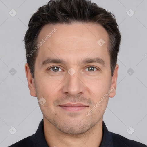 Joyful white adult male with short  brown hair and brown eyes