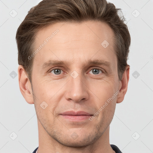 Joyful white adult male with short  brown hair and grey eyes