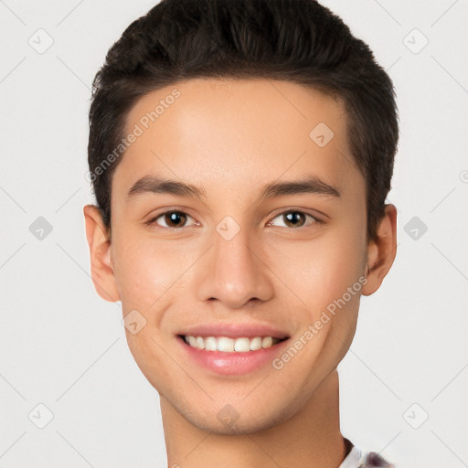 Joyful white young-adult male with short  black hair and brown eyes