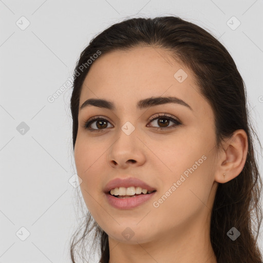 Joyful white young-adult female with long  brown hair and brown eyes