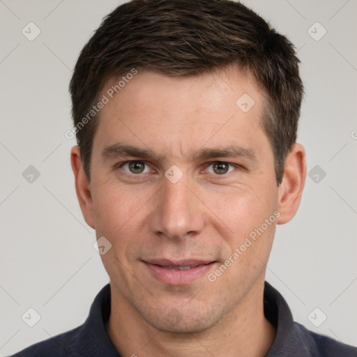 Joyful white adult male with short  brown hair and brown eyes